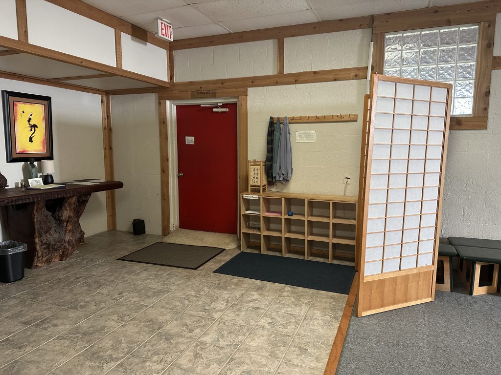 Entryway with shoe cubbies and coat hooks at Windsong Innerspace